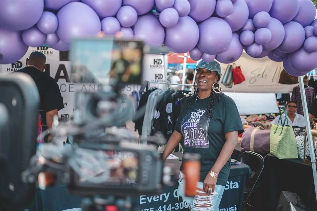 Business woman in the Black Wall Street Festival showing her business