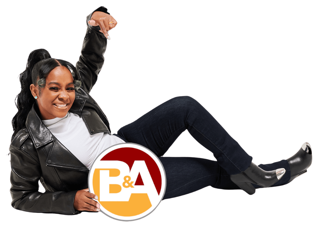Inesta Belardo on the floor holding the logo of B&A Benefit Solutions