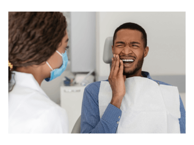 A man has a toothache because of tooth decay and consult a dentist for check up using his dental insurance plans