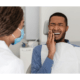 A man has a toothache because of tooth decay and consult a dentist for check up using his dental insurance plans