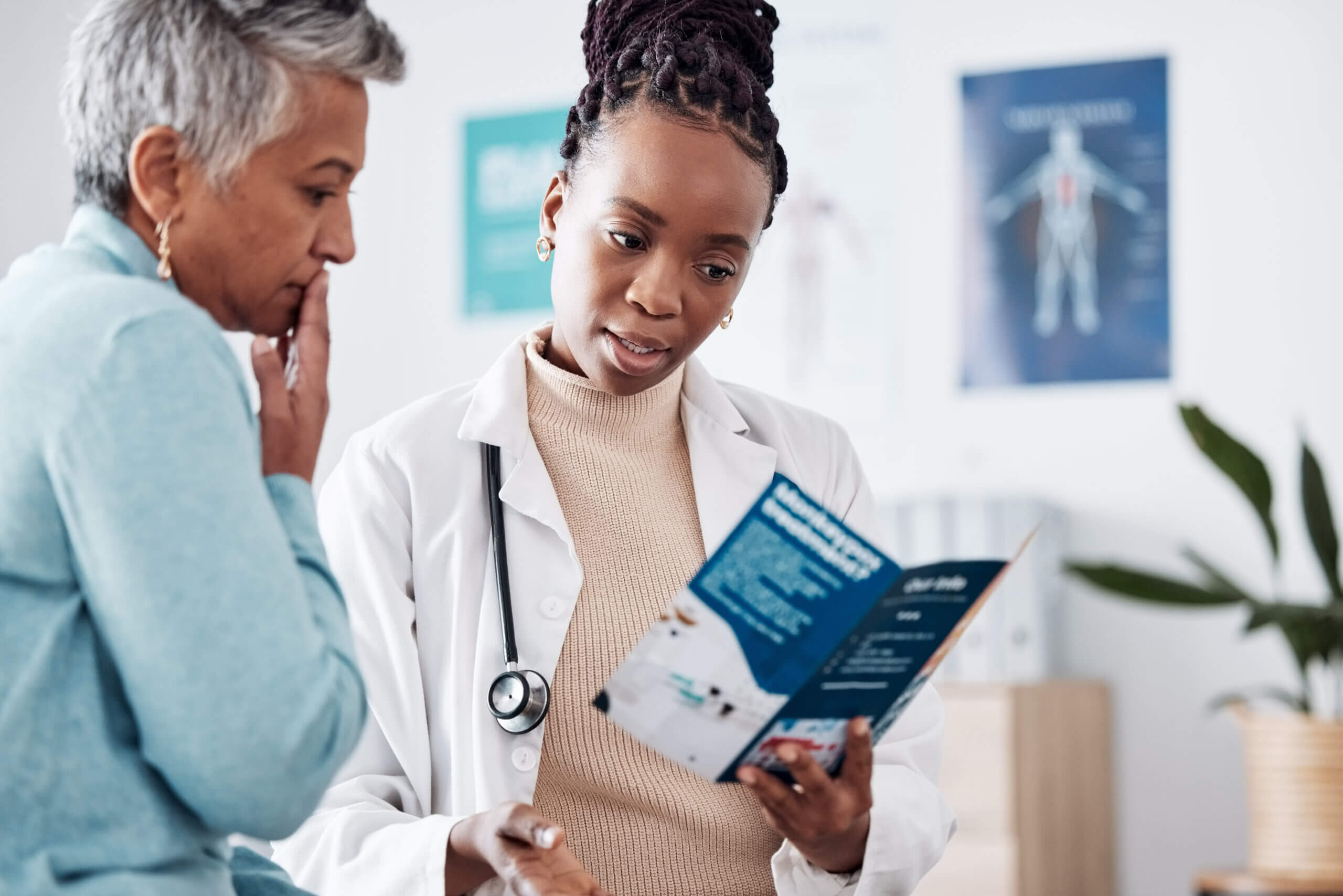 A nurse helping a woman for Insurance Shopping health coverage and instruct to buy insurance online