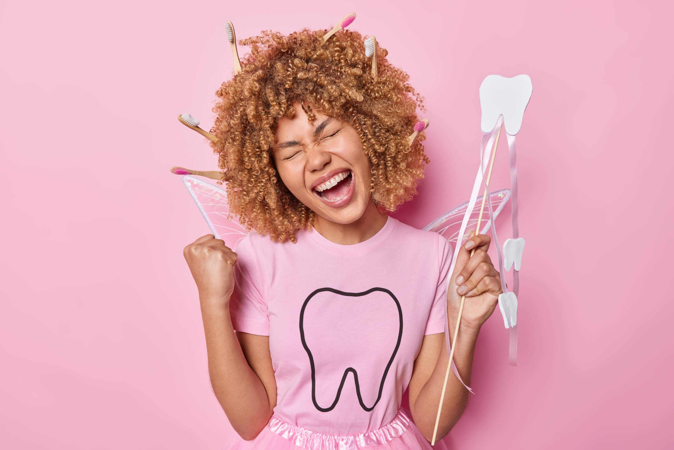 A tooth fairy girl happy for getting a Affordable Dental Coverage for Employees