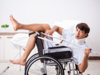 Young handsome man in wheelchair at the hospital