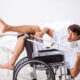 Young handsome man in wheelchair at the hospital